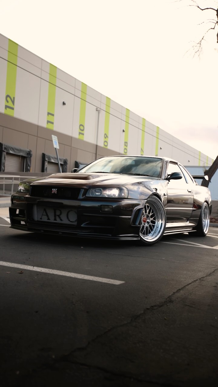 Nissan Skyline GT-R parked outside a warehouse in a Cross X Agency automotive reel